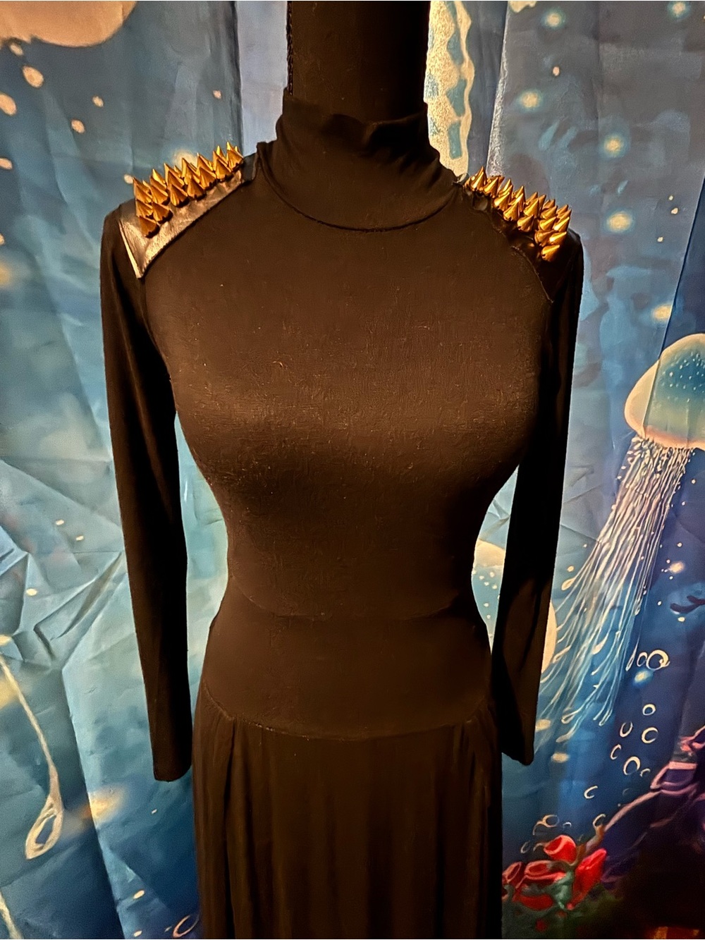 Black Maxi Dress fitted bodice,long sleeves with gold studded shoulders.